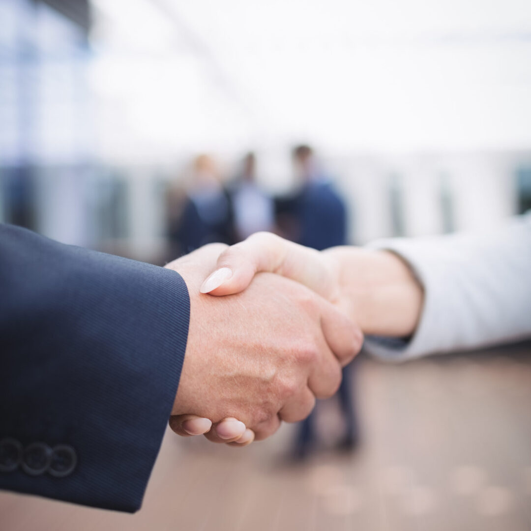 Close-up of businesspeople shaking hands
